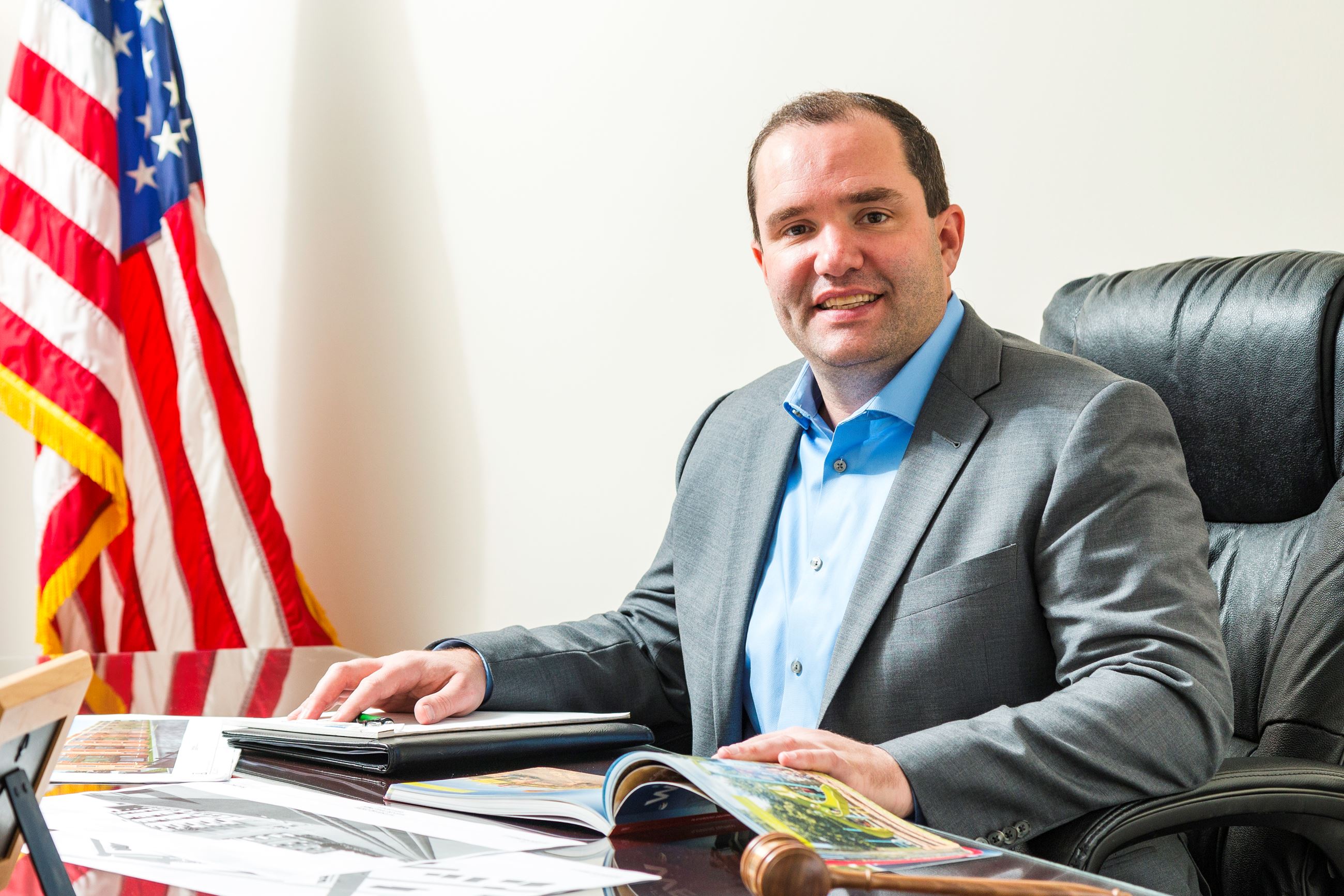 Mayor Dave Guerin sitting behind his desk at Village Hall