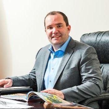 Mayor Dave Guerin sitting behind his desk at Village Hall