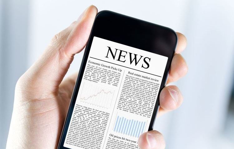 Handheld cellphone displaying news