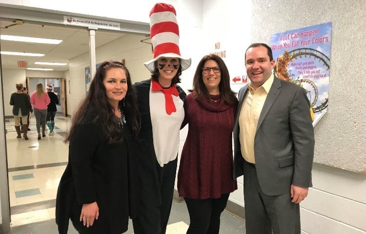Trustees Tracy Aller and Michele Obaya and Mayor Guerin posing with the Cat in the Hat