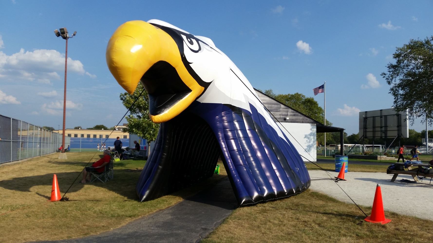Large inflatable blue, white and gold head of an eagle